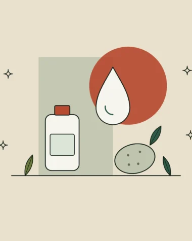 Gota de aceite de línea fina junto a una patata y una hoja, sobre un frasco de cosmética