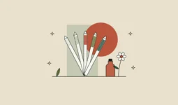 Abanico de tiras de papel para oler perfume junto a una flor y un pequeño frasco de esencia