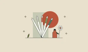 Abanico de tiras de papel para oler perfume junto a una flor y un pequeño frasco de esencia