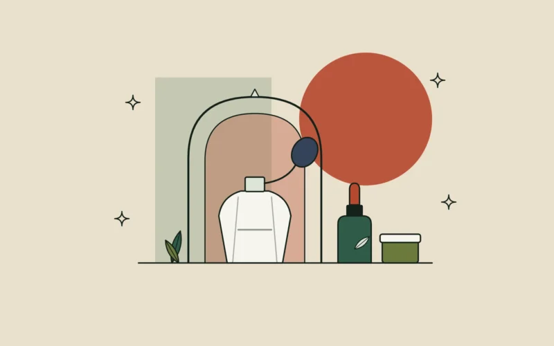 Ilustración de un perfumero con pera bajo un arco colonial, junto a un cuentagotas y un tarro, sobre fondo arena