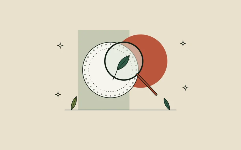 Lupa de línea fina sobre un sello circular que deja ver una hoja en su interior