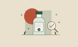 Frasco con etiqueta de ingredientes y una lupa con una marca de verificación: cómo leer la etiqueta de un cosmético
