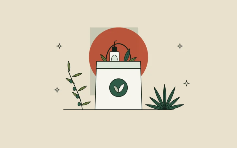 Bolsa de tienda con un frasco de sérum entre un olivo español y un agave mexicano.